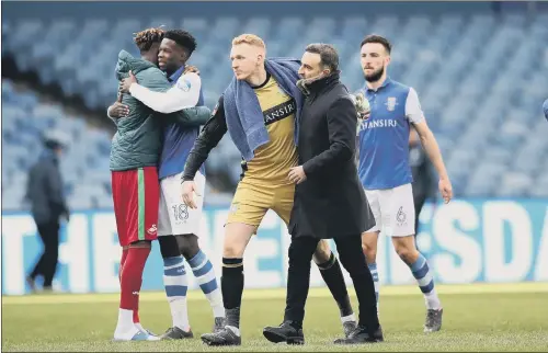  ?? PICTURE: LYNNE CAMERON/SPORTIMAGE ?? FAMILIAR FACE: Goalkeeper Cameron Dawson is hugged by former Sheffield Wednesday head coach Carlos Carvalhal after the FA Cup draw with Swansea.