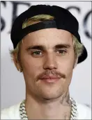  ??  ?? Justin Bieber arrives at the Los Angeles premiere of “Justin Bieber: Seasons.” Bieber leads this year’s list of nominees at the 2021MTV Video Music Awards, which will air from the Barclays Center in Brooklyn on Sept. 12.