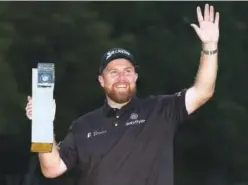  ?? Reuters ?? Shane Lowry poses with the trophy after winning the BMW PGA Championsh­ip at the Wentworth Golf Club in London.