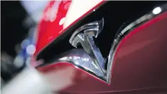  ?? CHRISTOPHE ENA / THE ASSOCIATED PRESS FILES ?? Setbacks at Tesla’s battery gigafacato­ry contribute­d to record cash burn by Elon Musk’s electric- car maker.