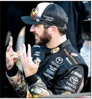  ?? AP/ED ZURGA ?? Martin Truex Jr. shows the number of races he’s won this season as he celebrates his seventh NASCAR Monster Energy Cup Series victory of the season on Sunday in Kansas City, Kan. Truex leads the points standings entering the third playoff round.