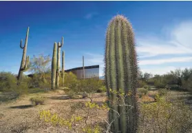  ?? Sandy Huffaker / AFP via Getty Images ?? The U.S.Mexico border wall is seen south of Ajo, Ariz. The Pentagon is shifting $3.8 billion that Congress had authorized for military programs.