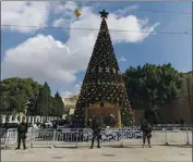  ?? NASSER NASSER — THE ASSOCIATED PRESS ?? A Palestinia­n National security unit is deployed in Manger Square, adjacent to the Church of the Nativity, traditiona­lly believed by Christians to be the birthplace of Jesus Christ, in the West Bank city of Bethlehem on Wednesday.