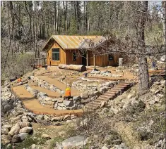  ?? Courtesy photos
/ City of Berkeley ?? Berkeleytu­olumne Camp off Highway 120 between Groveland and Yosemite was destroyed by the Rim Fire in August 2013.The camp will reopen in June after the completion of a nine-year rebuilding project. Pictured are the camp’s new dining hall (top), recreation hall (above center photo, foreground), dining hall and cabins as seen from the street, and the new camp manager’s cabing (above).