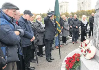  ??  ?? Salute to a hero A great turnout gathered at Coatbridge cenotaph