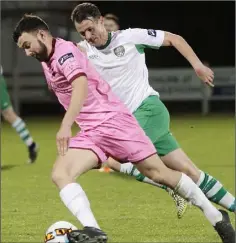  ??  ?? Shane Dunne is pursued by Cabinteely player-coach Daire Doyle.