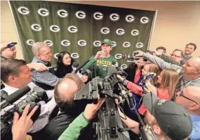 ?? ADAM WESLEY / USA TODAY NETWORK-WISCONSIN ?? Aaron Rodgers faces a horde of reporters during his availabili­ty Tuesday at Lambeau Field.