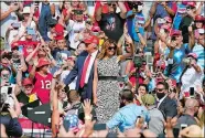  ?? CHRIS O’MEARA/AP PHOTO ?? President Donald Trump and first lady Melania Trump arrive for a campaign rally Thursday in Tampa, Fla.