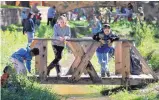  ?? EDDIE MOORE/JOURNAL ?? In 2013, Page Hernandez, 12, left, and cousin Anthony Cordova, 10, were among the participan­ts in Santa Fe’s annual Children’s Fishing Derby, which has been put on hold this year due to a water shortage.