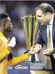  ?? FILE ?? CONCACAF president Victor Montaglian­i (right) greets Jamaican goalkeeper André Blake after the United States beat Jamaica 2-1 in the Gold Cup final in Santa Clara, California, on Wednesday, July 26.