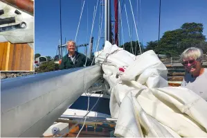  ?? ?? RIGHT: Helpers assist in removing the damaged mainsail – note the dent in the boom