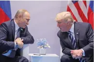  ?? — Reuters ?? CONTROVERS­Y: U.S. President Donald Trump speaks with Russian President Vladimir Putin during their bilateral meeting at the G20 summit in Hamburg, Germany on Friday.