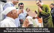  ??  ?? 104-year-old Pandurang Jagtap (extreme left) wishes Shiv Sena chief Uddhav Thackeray at Matoshree on Friday.