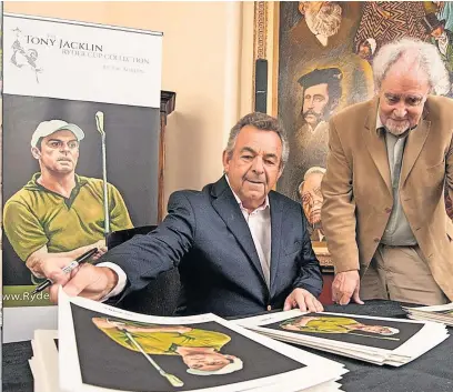  ?? ?? All for a good cause Tony Jacklin CBE signing the Golf Great limited edition prints with artist, Joe Austen