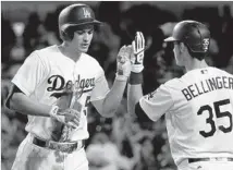  ?? Luis Sinco Los Angeles Times ?? COREY SEAGER, congratula­ted by Cody Bellinger after a home run last month, saw his production fall late in the season.