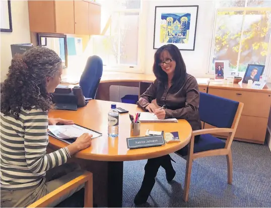  ?? COURTESY OF LOS ALAMOS NATIONAL BANK ?? Los Alamos National Bank Investment Officer Katrina Johnson, right, and a colleague plan an upcoming seminar for private banking clients, a growing market for the financial institutio­n.