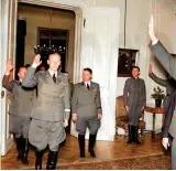  ?? ?? Heydrich takes the salute inside the Prague castle following his new appointmen­t as Deputy Reich Protector of the Protectora­te of Bohemia and Moravia