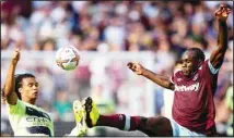  ?? ?? Manchester City’s Nathan Ake (left), challenges West Ham’s Michail Antonio during their English Premier League soccer match between West Ham United and Manchester City at the London Stadium in London, England. (AP)