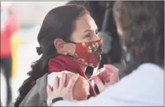  ?? Brian A. Pounds / Hearst Connecticu­t Media ?? Dr. Corina Marcu receives one of the first fifteen doses of the Pfizer COVID-19 vaccine at Hartford Hospital on Monday.