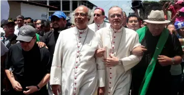  ??  ?? Brenes (left) and Managua’s Bishop Silvio Baez leaders arrive in the city as anti-government protests continue in Diriamba, Nicaragua. — Reuters photo