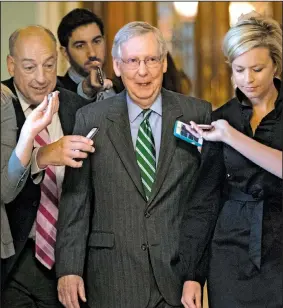 ?? AP/J. SCOTT APPLEWHITE ?? Senate Majority leader Mitch McConnell (center) leaves the chamber after announcing the release of the Senate Republican­s’ health care bill Thursday at the Capitol in Washington.