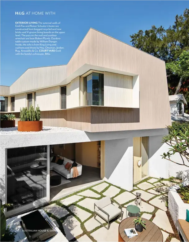  ??  ?? 20
EXTERIOR/LIVING The external walls of Emili Fox and Reiner Schuster’s home are constructe­d from bagged recycled and new bricks and V-groove lining boards on the upper level. The pots on the roof and outdoor armchair are from Robert Plumb. Outdoor table custom-made by William Dangar.
Inside, the sofa is from King Living and cushions and throw by Hay. Ottoman, Jardan. Rug, Armadillo & Co. COURTYARD Emili with the family’s schnauzer, Billie.