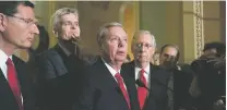  ?? J. SCOTT APPLEWHITE/THE ASSOCIATED PRESS ?? From left, Republican Sens. John Barrasso of Wyoming, Bill Cassidy of Louisiana, Lindsey Graham of South Carolina and Majority leader Mitch McConnell of Kentucky speak to the media Tuesday in Washington as they face defeat on the Graham-Cassidy bill,...