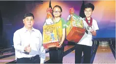  ??  ?? Winners of the Classified Masters (from left) Chong Jun Foo, Nikhil Gangaran and Haziq Sahli posing with their prizes.