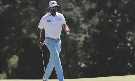  ?? AP PHOTO/ASHLEY LANDIS ?? Max Homa waves after making a putt on the 18th hole during second round at the Masters golf tournament at Augusta National Golf Club on Friday in Augusta, Ga.