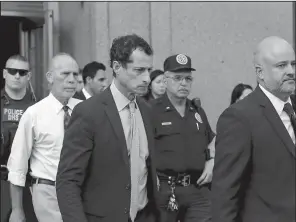  ?? AP/MARK LENNIHAN ?? Former U.S. Rep. Anthony Weiner (center) leaves federal court Monday after his sentencing.