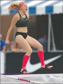  ?? The Associated Press ?? USA TITLE: Sandi Morris celebrates Sunday after clearing the bar in the women’s pole vault at the USA Outdoor Track and Field Championsh­ips in Des Moines, Iowa.