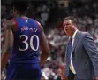  ?? BRAD TOLLEFSON - THE ASSOCIATED PRESS ?? Kansas coach Bill Self yells at Ochai Agbaji (30) after he let the ball go out of bounds during the second half of an NCAA college basketball game against Texas Tech, Saturday, March 7, 2020, in Lubbock, Texas.