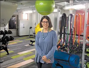  ?? Star Tribune/CHRISTOPHE­R SNOWBECK ?? Anne Hendrickso­n is the owner of Work It, a new co-working space in St. Paul, Minn., with active work stations and fitness gear so clients can avoid being sedentary.