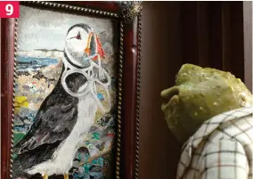  ??  ?? Old friend: Mr Toad hangs a portrait of a plastic-choked puffin 9