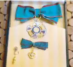  ??  ?? The Order of Merit of the Italian Republic is awarded for merit acquired by the nation in the fields of literature, the arts, economy, public service, and social, philanthro­pic and humanitari­an activities and for long and conspicuou­s service in...
