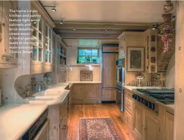  ??  ?? The home’s main kitchen and pantry feature light wood cabinets and brick detailing. lower right: A formal garden leads to the home’s main entrance on Clinton Street.