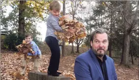  ?? Chris Carlson / Associated Press ?? Christophe­r Hughey poses for a picture with his sons, Henry, 5, Harrison, 9, on Saturday in Charlotte, N.C. Food experts say Americans nervous about making their first Thanksgivi­ng meals can follow a few basic tips to avoid disaster.