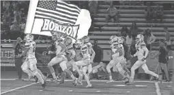  ?? DARRYL WEBB/SPECIAL FOR THE REPUBLIC ?? Horizon players make their way onto the field before their game against Saguaro in Scottsdale on Oct. 22.