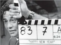  ?? BEACH POST TOM ERVIN / THE PALM ?? Peter Falk prepares for a take during filming of “Happy New Year” at the West Palm Beach Amtrak station in June 1985.