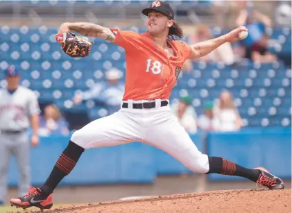  ?? BILLY SCHUERMAN/STAFF ?? Norfolk Tides pitcher DL Hall has touched 101 mph with his fastball, but he recently realized opposing batters knew when that pitch was coming. That could explain why his ERA has grown to 5.17 after a rough June.