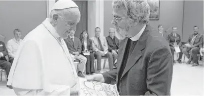  ?? Associated Press ?? Pope Francis meets Brother Guy Consolmagn­o, a Jesuit astronomer, at the Vatican’s Observator­y earlier this month.