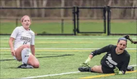  ?? Robert Simmons / Siena Athletics ?? Carrie Krohn of Siena watches her shot go in the goal past Rider goalie Ellie Sciancalep­ore on Monday, giving the Saints the early lead.