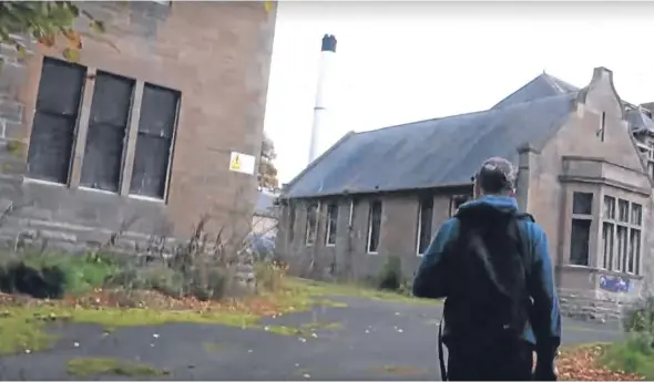  ??  ?? One of the youths inside the grounds of the derelict Strathmart­ine Hospital.