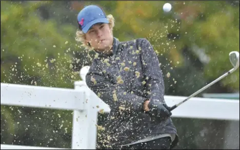  ?? Staff photo/ Jake Dowling ?? St. Marys’ Cole Koenig hits his golf ball out of the bunker at hole No. 11 during the Division I Boys Golf District Tournament on Thursday at the Findlay Country Club.