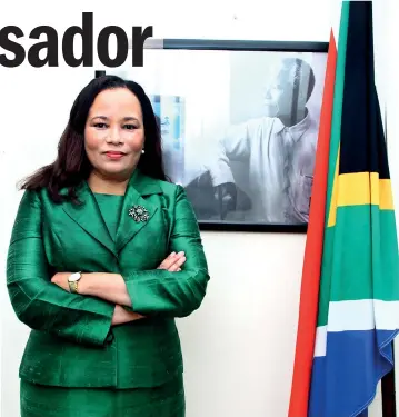  ??  ?? Their guiding light: South African High Commission­er Robina Marks stands next to a framed picture of the iconic leader Nelson Mandela. Pic by Indika Handuwala