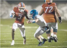  ?? BRAD HORRIGAN/HARTFORD COURANT ?? Bloomfield running back Anthony Simpson carries the ball against Plainville in the semifinals of the CIAC Class S football in December 2019 at Bloomfield High School.