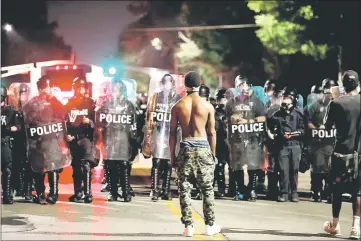  ??  ?? Protesters face off with law enforcemen­t of cials after Stockley was acquitted of murder in the 2011 fatal shooting of Anthony Lamar Smith in St. Louis, Missouri, US. — Reuters photo