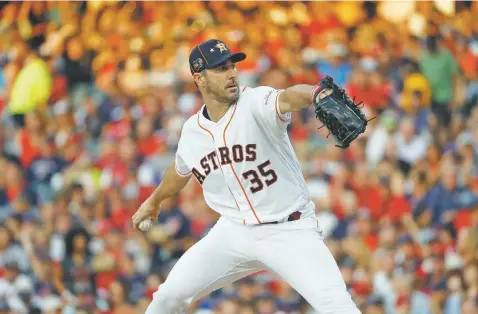 ?? PHOTOS BY JOHN MINCHILLO/ASSOCIATED PRESS ?? American League starting pitcher Justin Verlander of the Astros throws during the first inning of the All-Star Game against the National League on Tuesday in Cleveland. The AL won, 4-3.