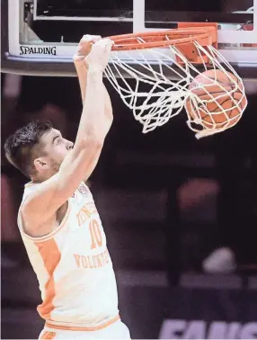 ?? CAITIE MCMEKIN/POOL VIA NEWS SENTINEL ?? Tennessee's John Fulkerson (10) dunks the ball during a season-opener game against Colorado at Thompson-boling Arena.