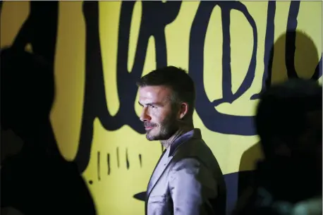  ?? BRYNN ANDERSON — THE ASSOCIATED PRESS ?? David Beckham poses for a photograph before a Christian Dior pre-fall 2020 men’s fashion collection presentati­on during Art Basel on Tuesday in Miami.